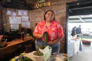 Smiling lady from Boquete holding a healthy juice